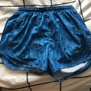Different shades of blue nike running shorts